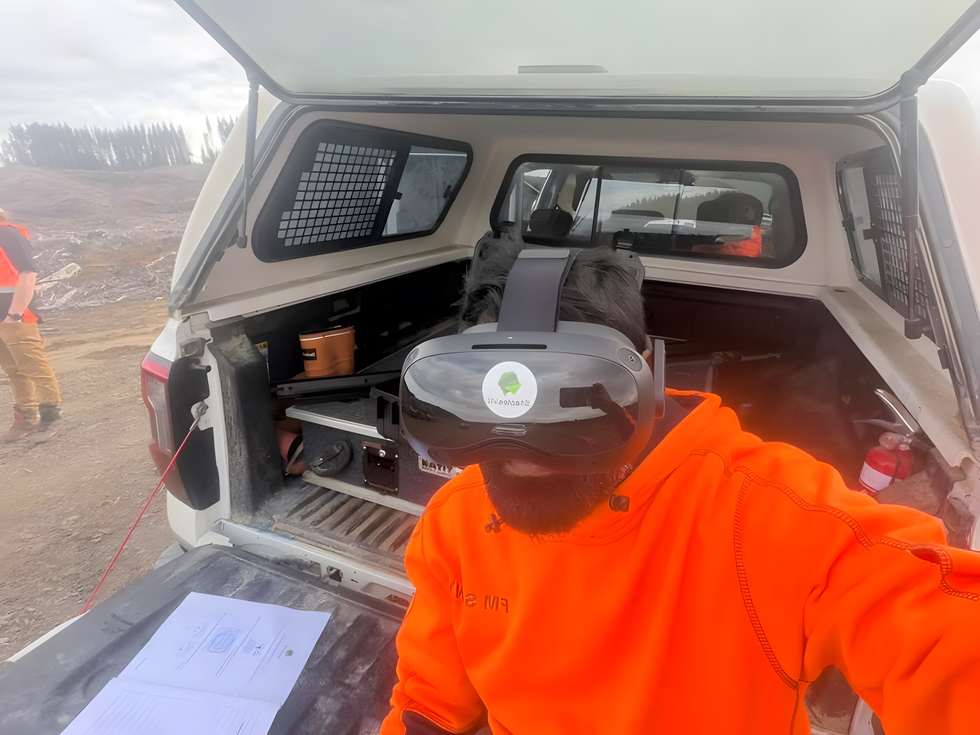 An FM Silvi crew member in the back of the ute